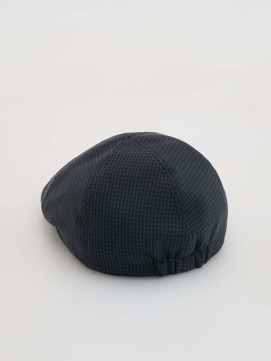 Berretto con visiera a quadri grigio scuro