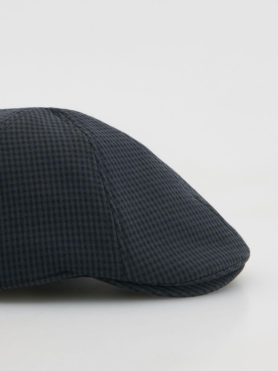 Berretto con visiera a quadri grigio scuro